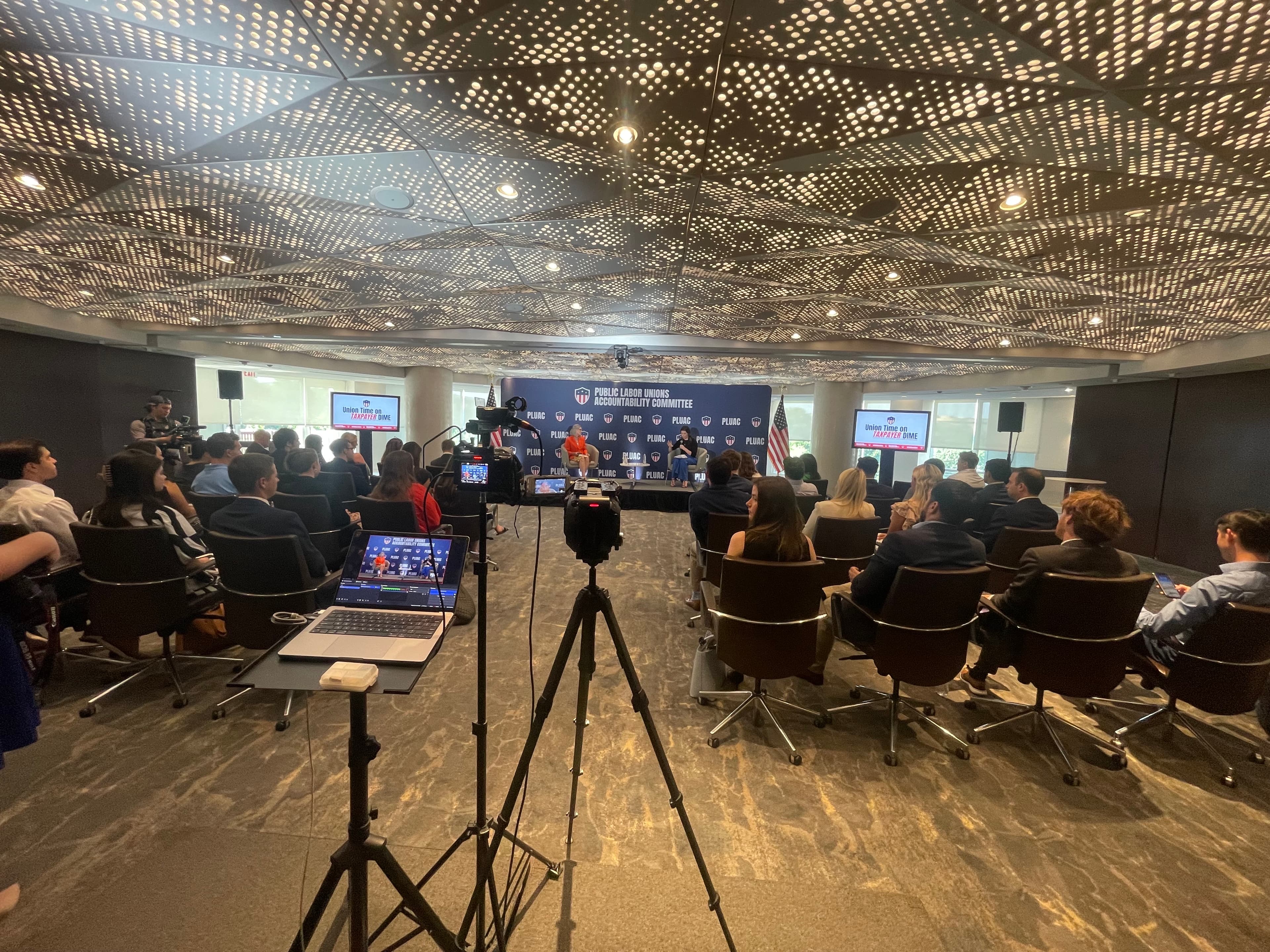 Government campaign hybrid event setup with professional staging and livestream capabilities
